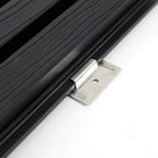 Close-up of stainless steel installation bracket clipped beneath the edge of black composite cladding