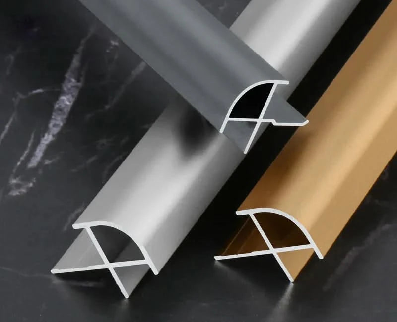 Aluminum wall panel outside corner trim profiles in black, silver, and gold finishes, showcasing durable metal edge strips for clean, modern wall panel corners