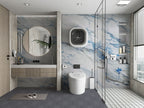 Modern bathroom interior with blue vein marble wall panels and glass shower enclosure