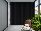 Luxe Noir black WPC fluted 3D wall panels modern accent wall with indoor greenery