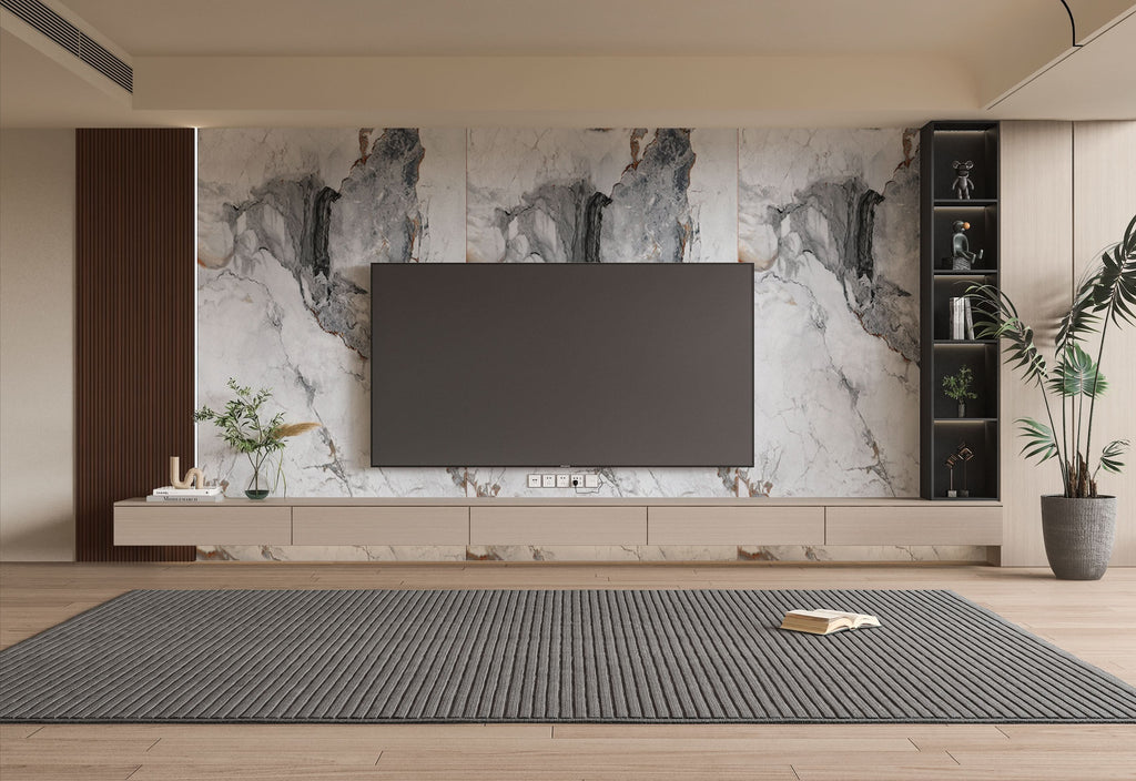 Modern living room TV wall with large marble wall panels, floating media unit, and built-in shelving