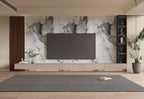 Modern living room TV wall with large marble wall panels, floating media unit, and built-in shelving