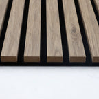 End view showing the wood slat profiles and black sound-absorbing panel backing