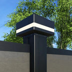 “Black aluminum fence post cap with horizontal LED light band installed on modern privacy fence”