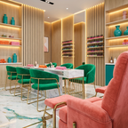 Modern nail salon with light oak acoustic slat wall panel feature walls and LED lighting