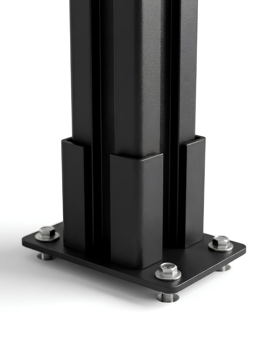 Close-up of the black above-ground fence post base plate secured with four bolts