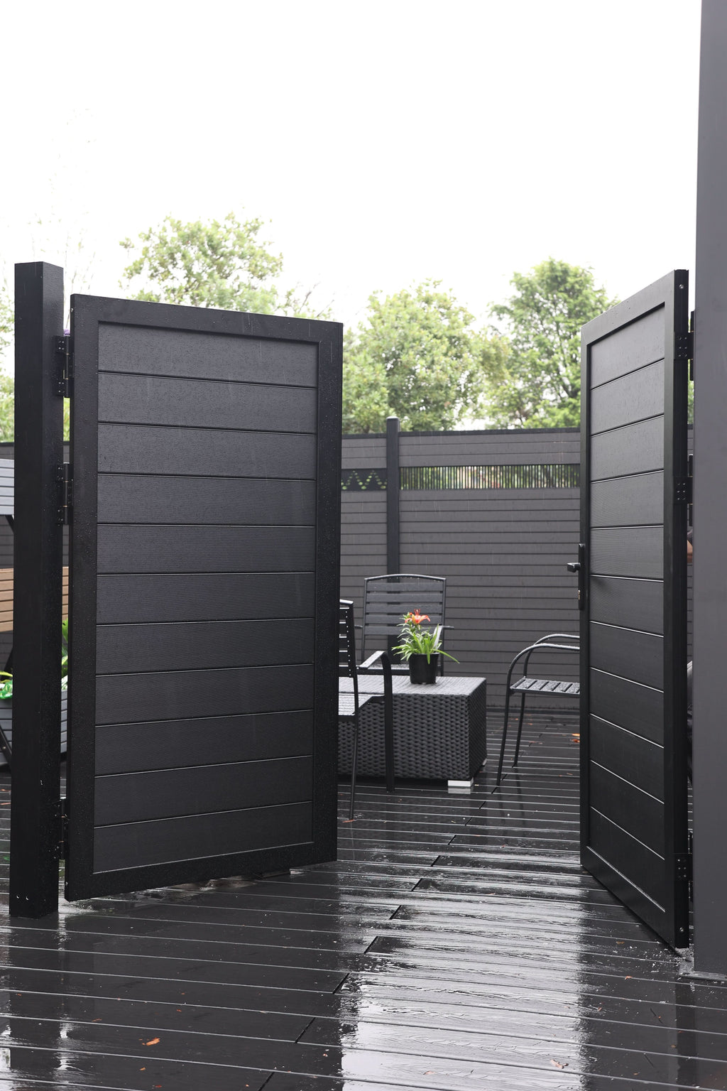 Black aluminum double privacy fence gate open inward with horizontal slat panels
