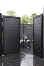 Black aluminum double privacy fence gate fully open with horizontal slat panels