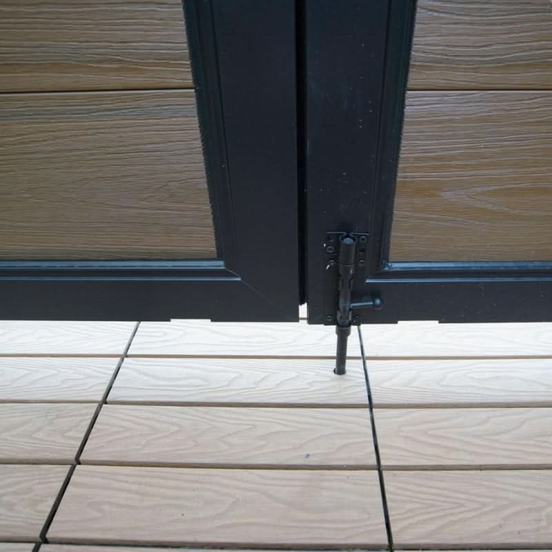 Composite double gate drop rod stopper at bottom hinge on aluminum frame