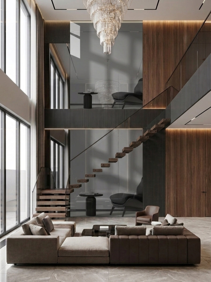 Floor-to-ceiling gray mirror panels reflecting a double-height living room with floating stairs and wood walls