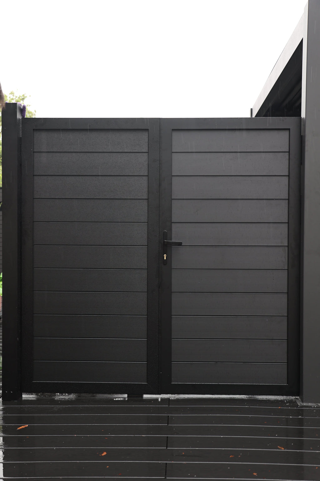 Black aluminum double privacy fence gate with horizontal panels and modern design