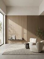 Ash wood veneer wall panels with vertical slatted texture installed in a bright modern living room