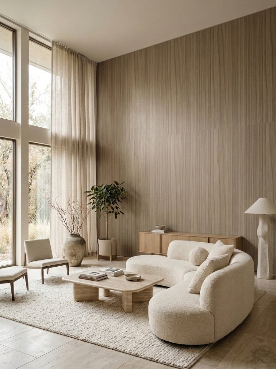 Ash wood veneer feature wall in a bright living room with curved white seating