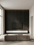 Dark Blackwood veneer wall panels creating a floor-to-ceiling TV feature wall in a modern living room
