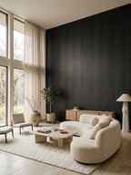Blackwood veneer wall panel installation with vertical grain in a bright neutral living room