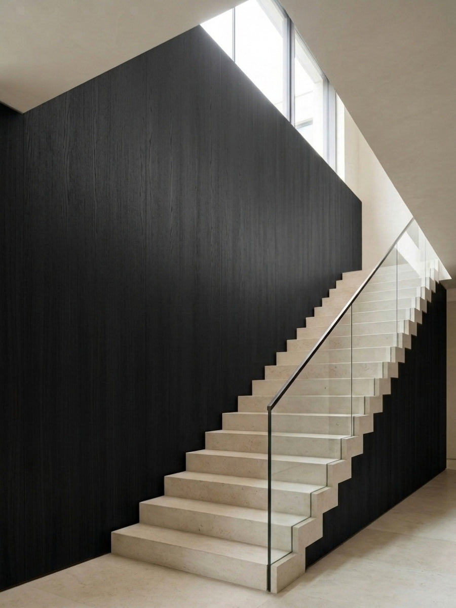 Blackwood veneer commercial wall panels installed along a modern staircase with glass railing