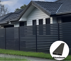 Dark gray aluminum horizontal slat privacy fence installed along residential property boundary