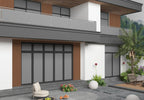 Modern home exterior with brown composite wide cladding panels and balcony