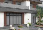 Modern home exterior with vertical brown WPC fluted wall panels and balcony design