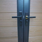 Composite double gate handle and lock hardware on aluminum frame