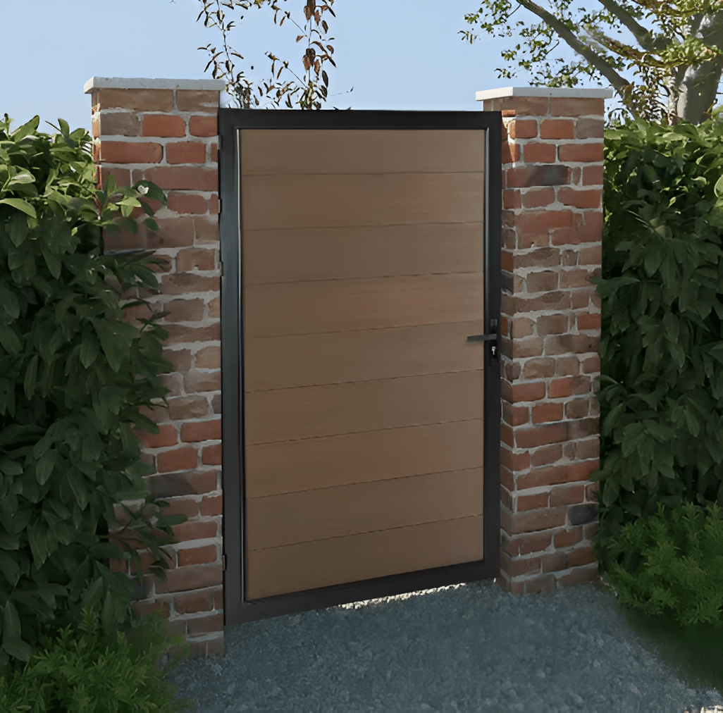 Brown composite single fence gate with aluminum frame between brick pillars