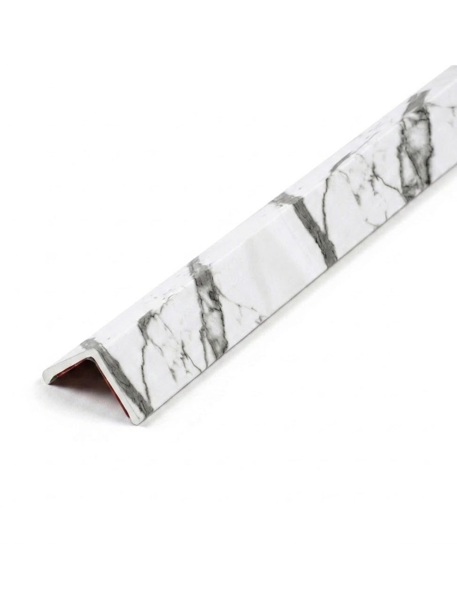 White marble-look wall panel trim with gray veining and an angled profile