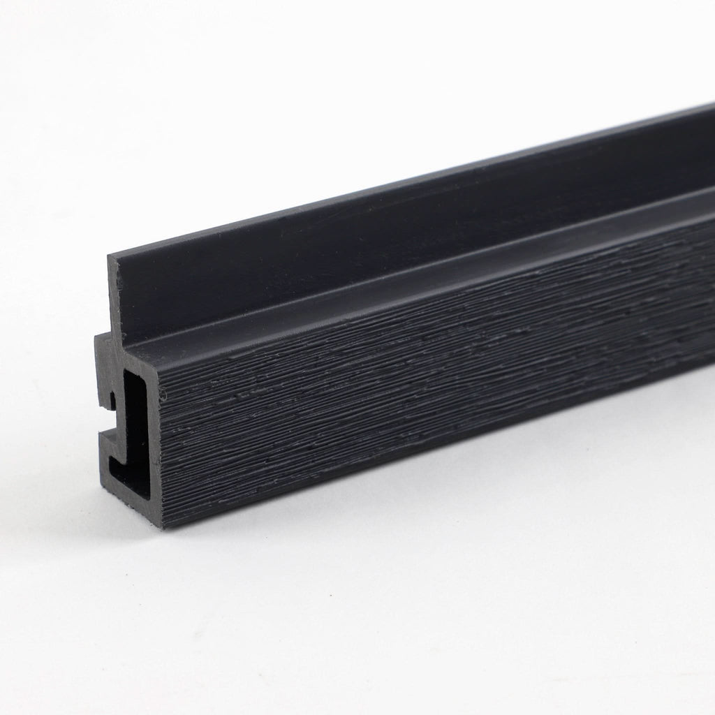 Black composite trim profile with wood grain texture and mounting channel