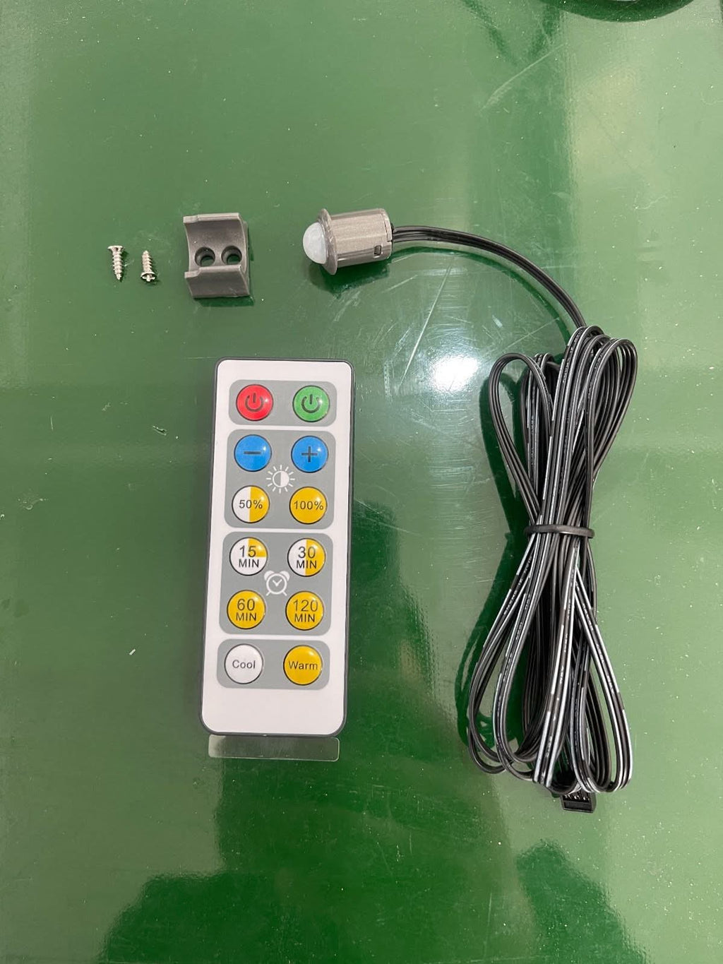 LED recessed lighting kit remote control with timer buttons, mounting clip, screws, and power cable