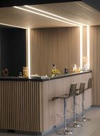 Fluted wall and ceiling panels with integrated recessed LED strip lighting for modern bar interior