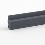 Dark gray composite trim profile with textured wood grain finish