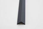 Dark gray aluminum corner trim for wall panels with clean angled edge finish
