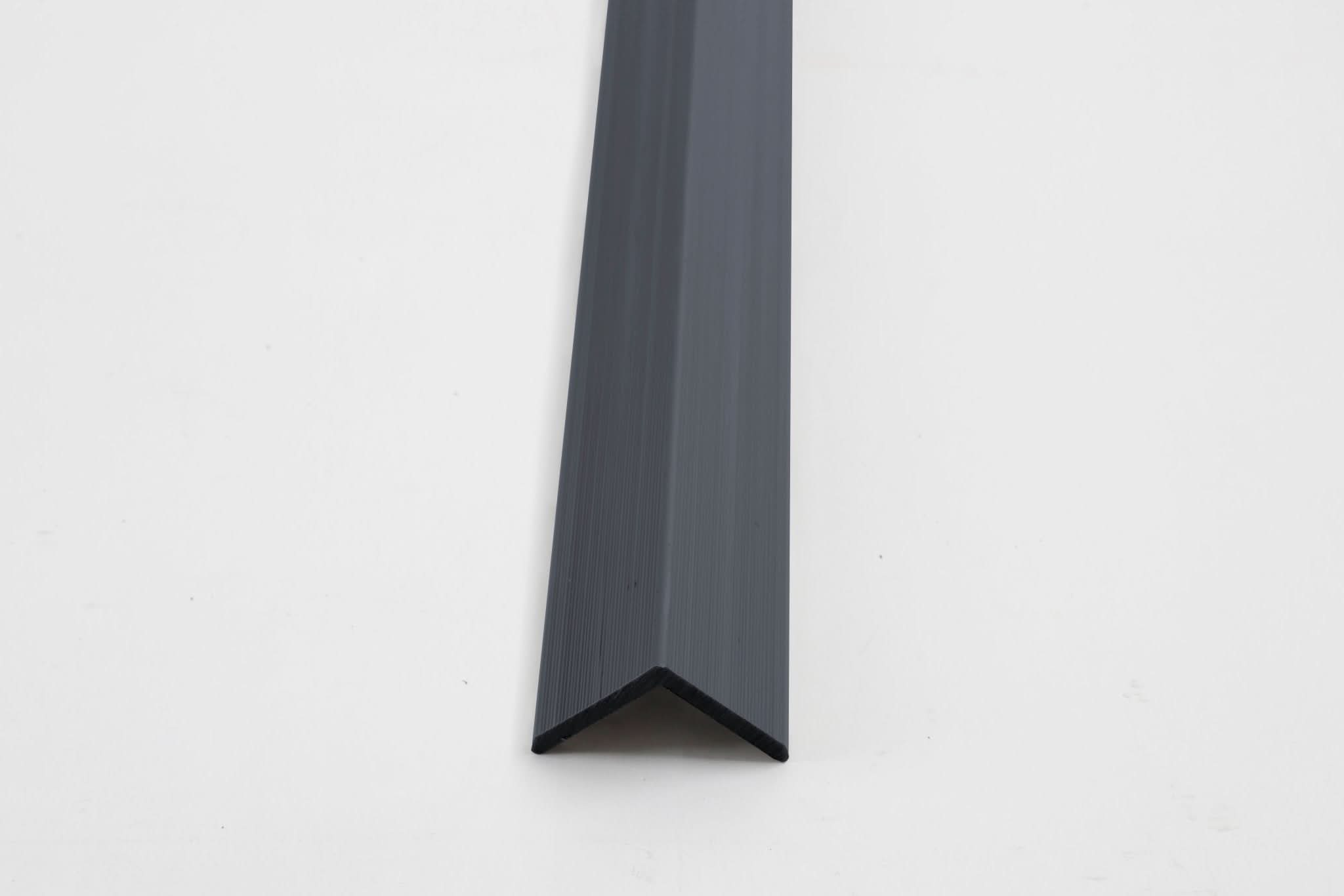 Dark gray aluminum corner trim for wall panels with clean angled edge finish
