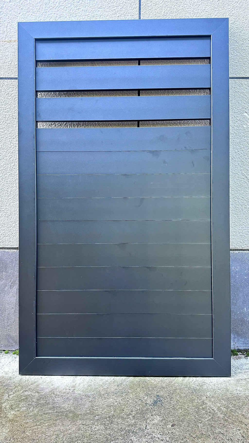 Dark gray composite slatted single fence gate with aluminum frame