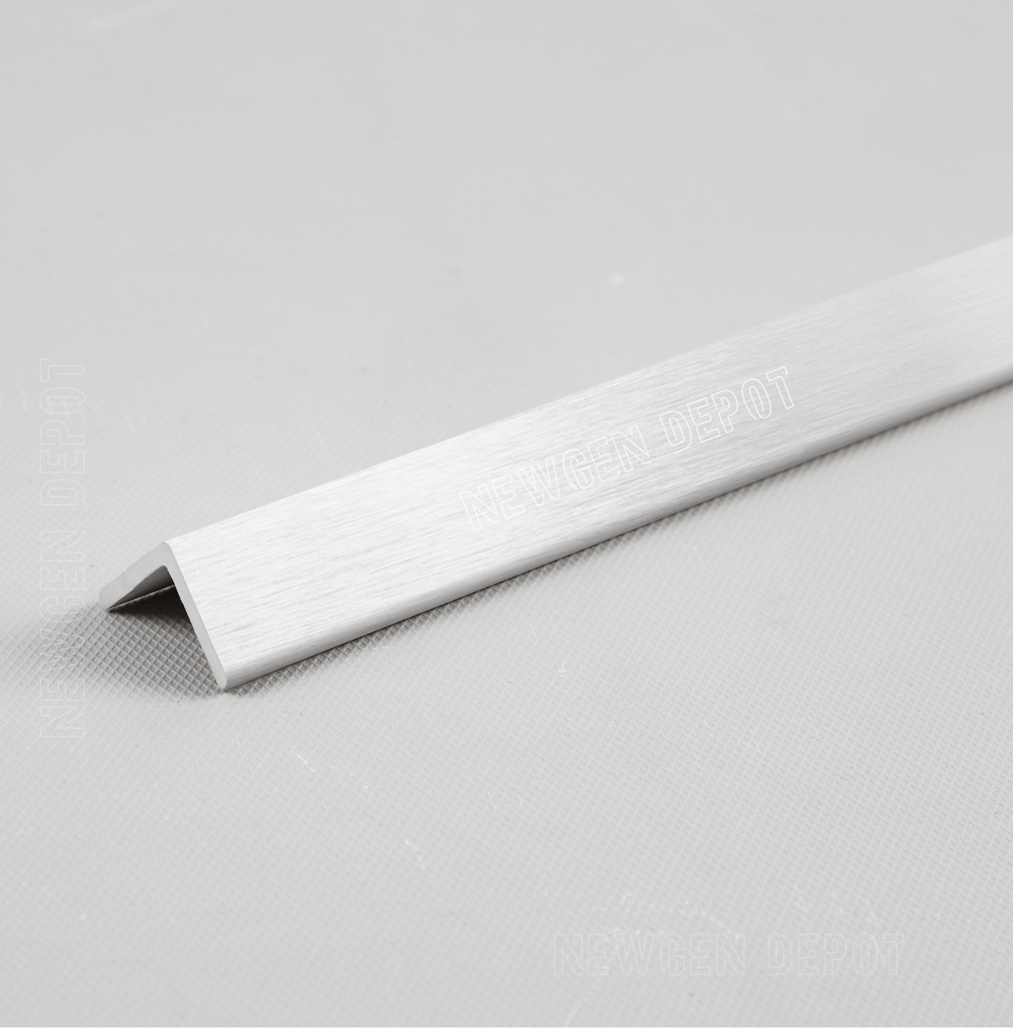 Silver brushed aluminum corner trim, 90-degree angle, premium finish for NJ furniture edges, sleek and durable design.
