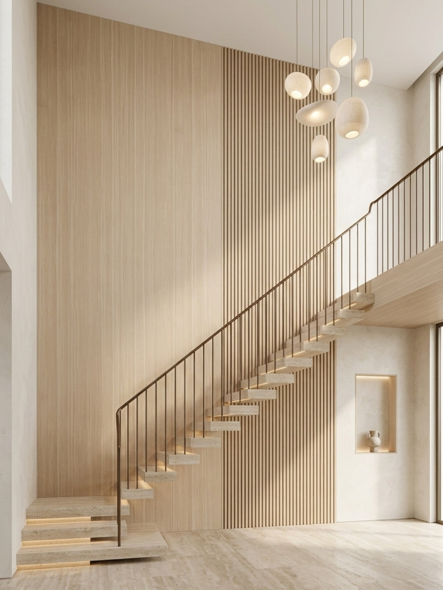 Light Nordic birch wood veneer panels with vertical slatted detailing installed along a modern staircase wall