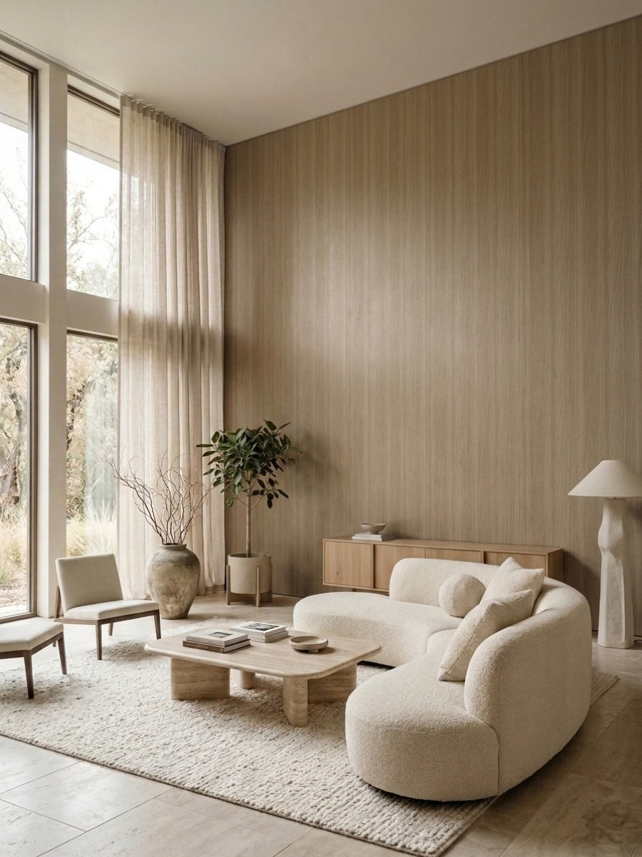 Royal Oak wood veneer feature wall in a bright living room with curved cream seating and tall windows