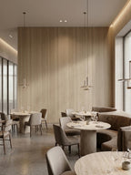 Royal Oak wood veneer feature wall in a modern restaurant with round tables and pendant lights