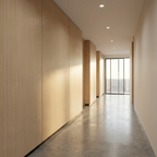 Nordic birch wood veneer panels with vertical grain installed along a narrow hallway