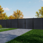 Dark gray composite driveway gate with matching privacy fence panels