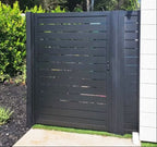 Black aluminum slatted single fence gate with modern privacy design