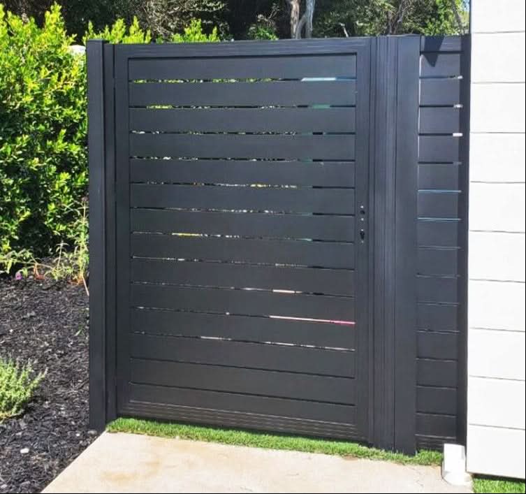 Black aluminum slatted single fence gate with modern privacy design