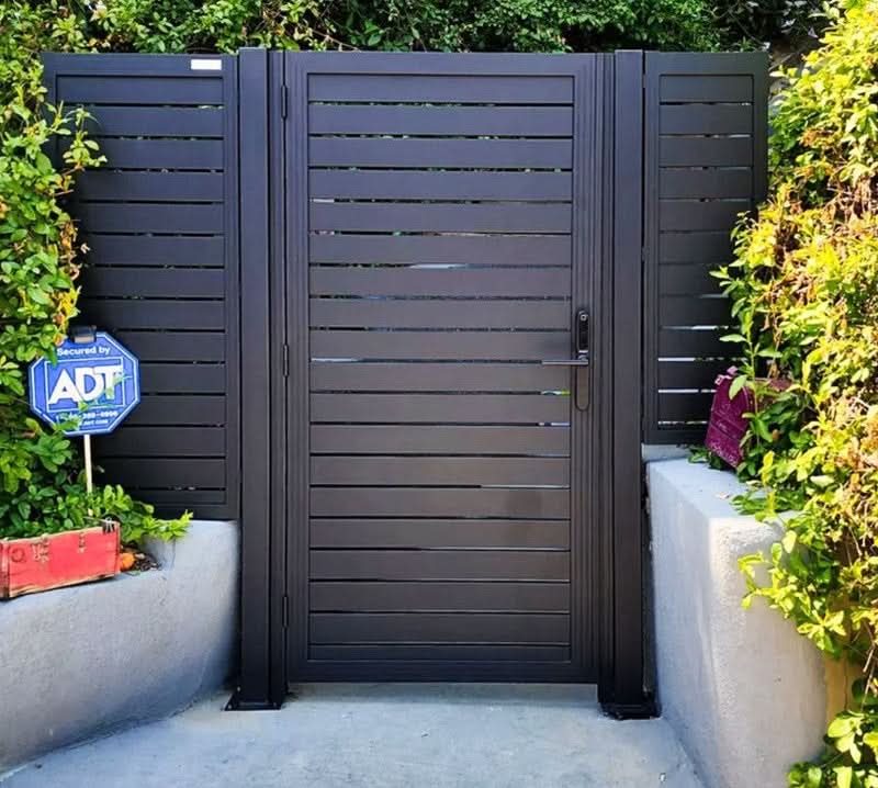 Dark gray composite slatted single fence gate with aluminum frame