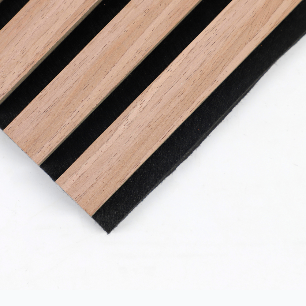 Close-up of wood slat acoustic panel showing natural oak slats and black felt backing