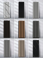 Nine WPC slat fluted wall panel samples in assorted wood, marble-look, black, gray and neutral finishes