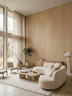 White oak veneer feature wall in a bright living room with curved seating
