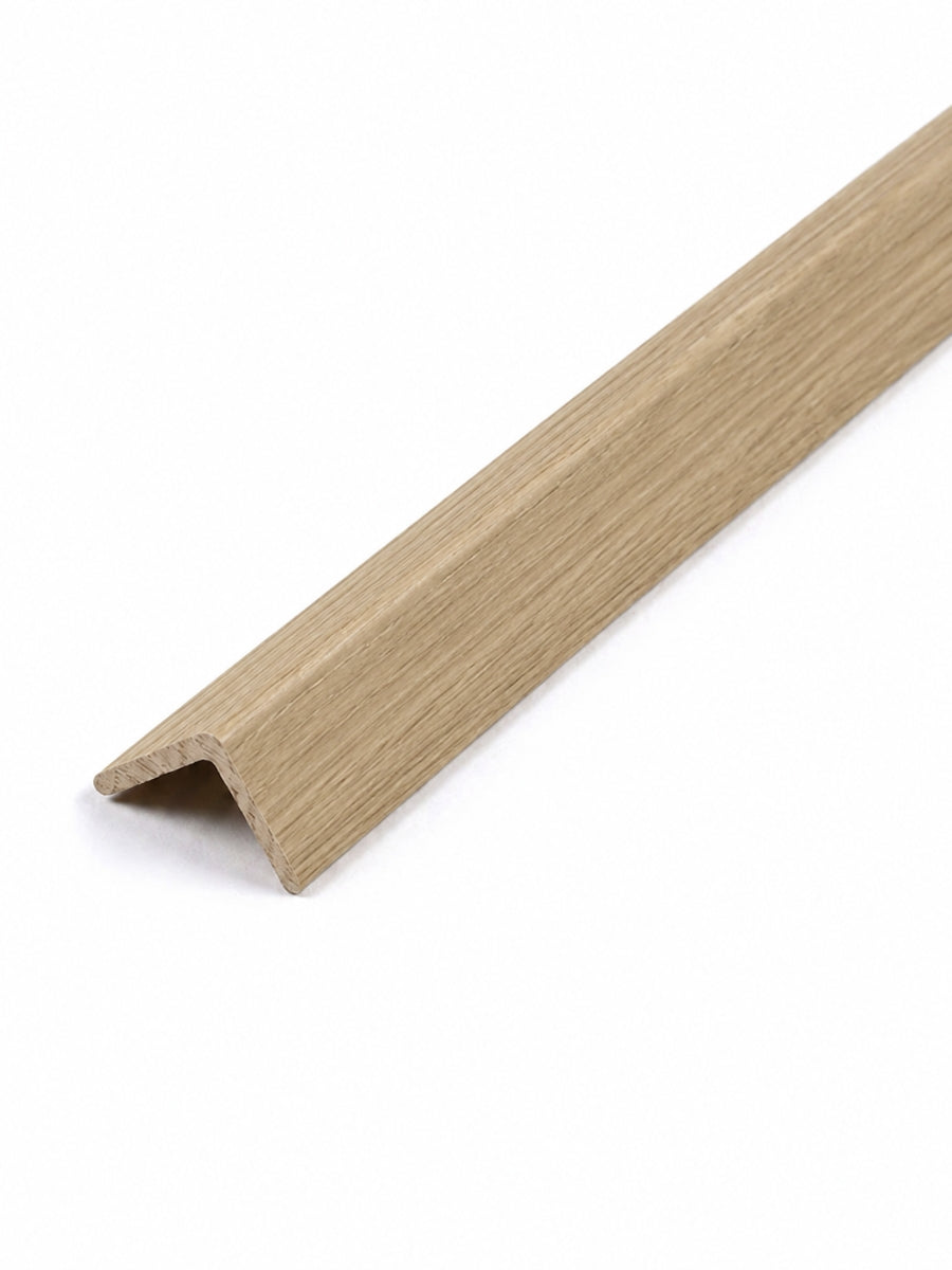 Light natural wood-look angled wall panel trim with visible grain