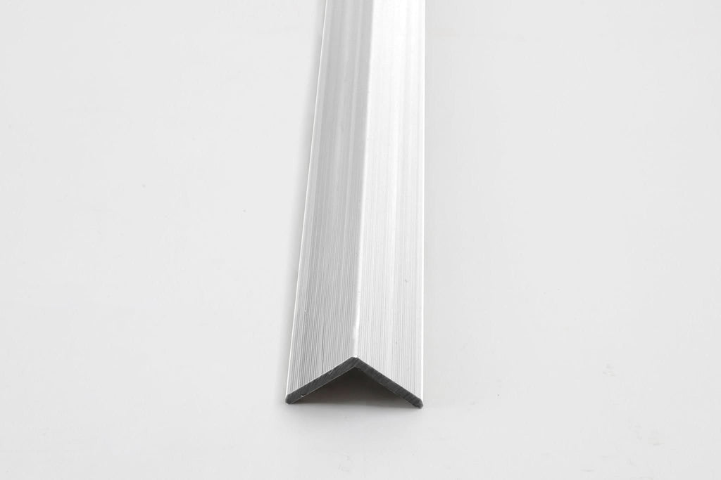 Silver aluminum corner trim for wall panels with clean angled edge finish