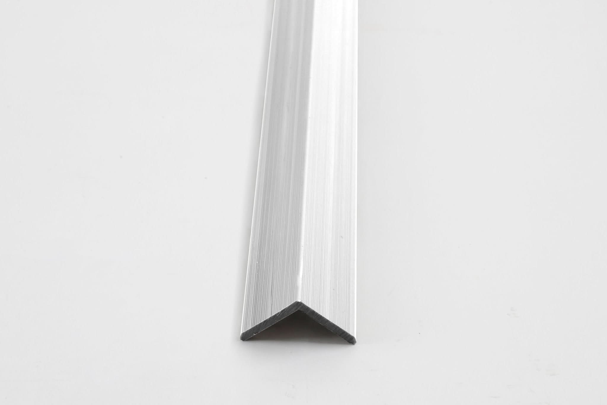 Silver aluminum corner trim for wall panels with clean angled edge finish