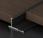Black aluminum wall panel H joint trim installed between wood panels, durable metal connector profile for seamless panel joints and modern interior wall finishes
