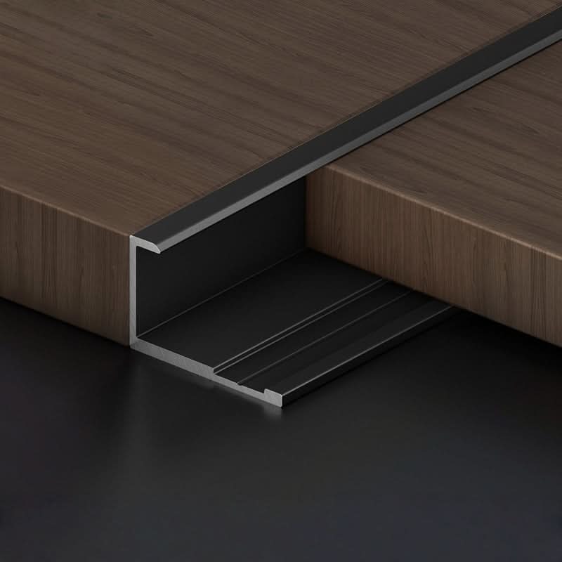 Black aluminum wall panel L trim cap installed between wood panels for seamless edge finishing
